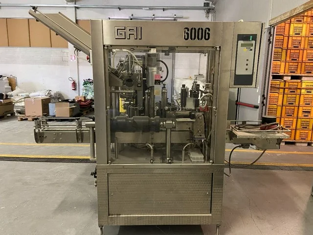 Gai capsuling machine with labeller