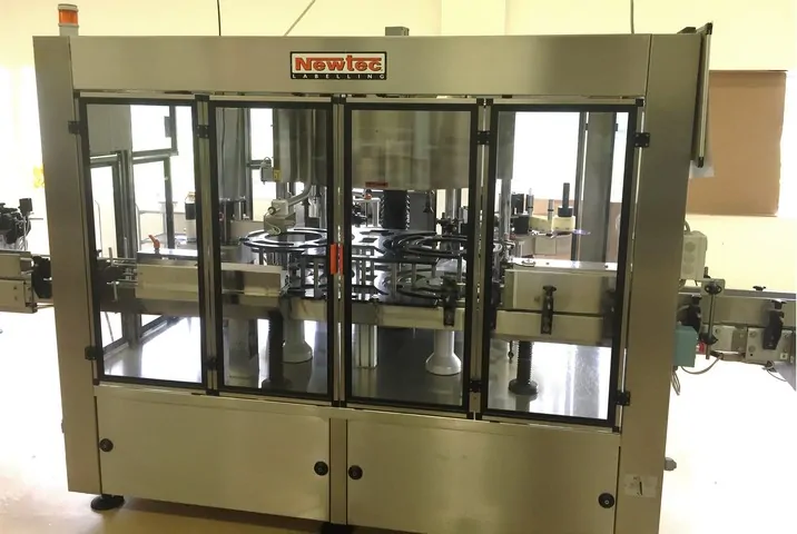 Used labeller Newtec adhesive 3.500 bph photo 2