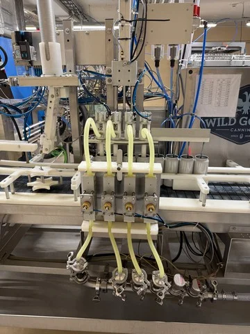 Wild Goose gravity canning line for beer